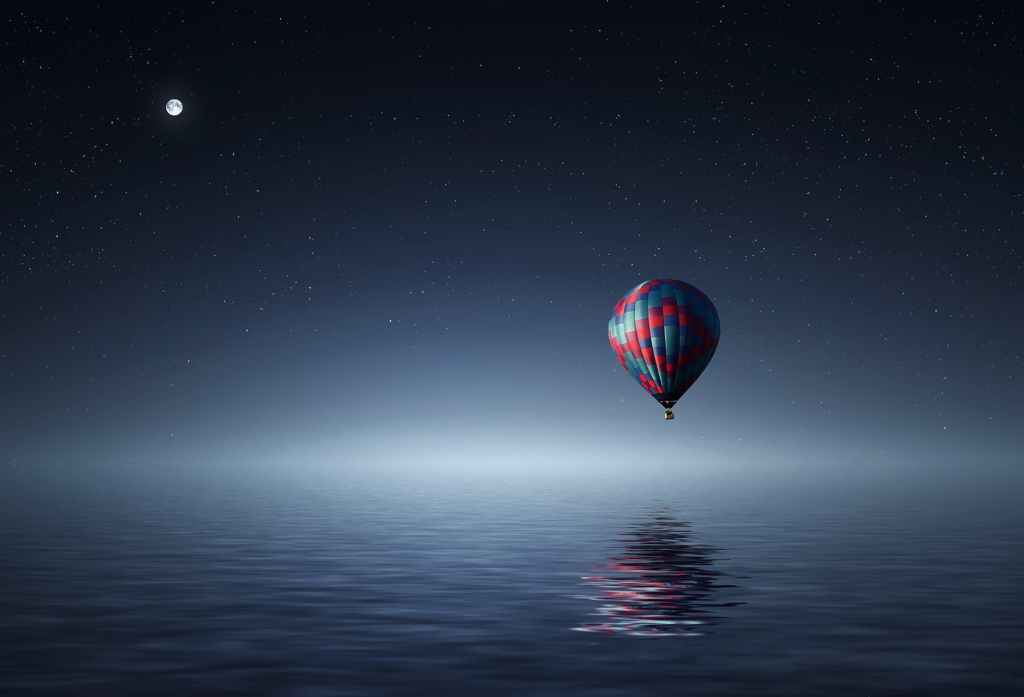Balloon hovering above water